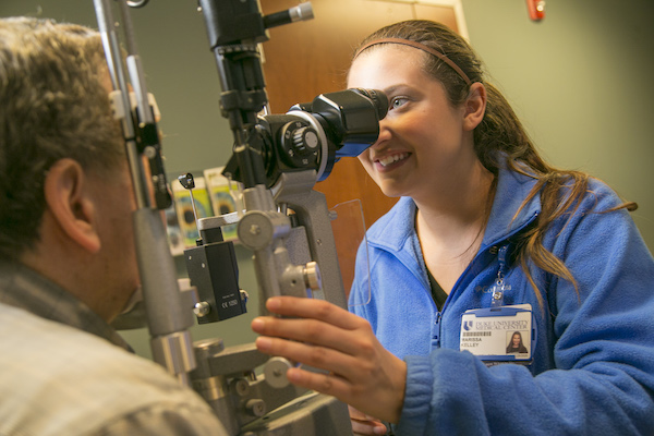 OpTech Student at Slit Lamp