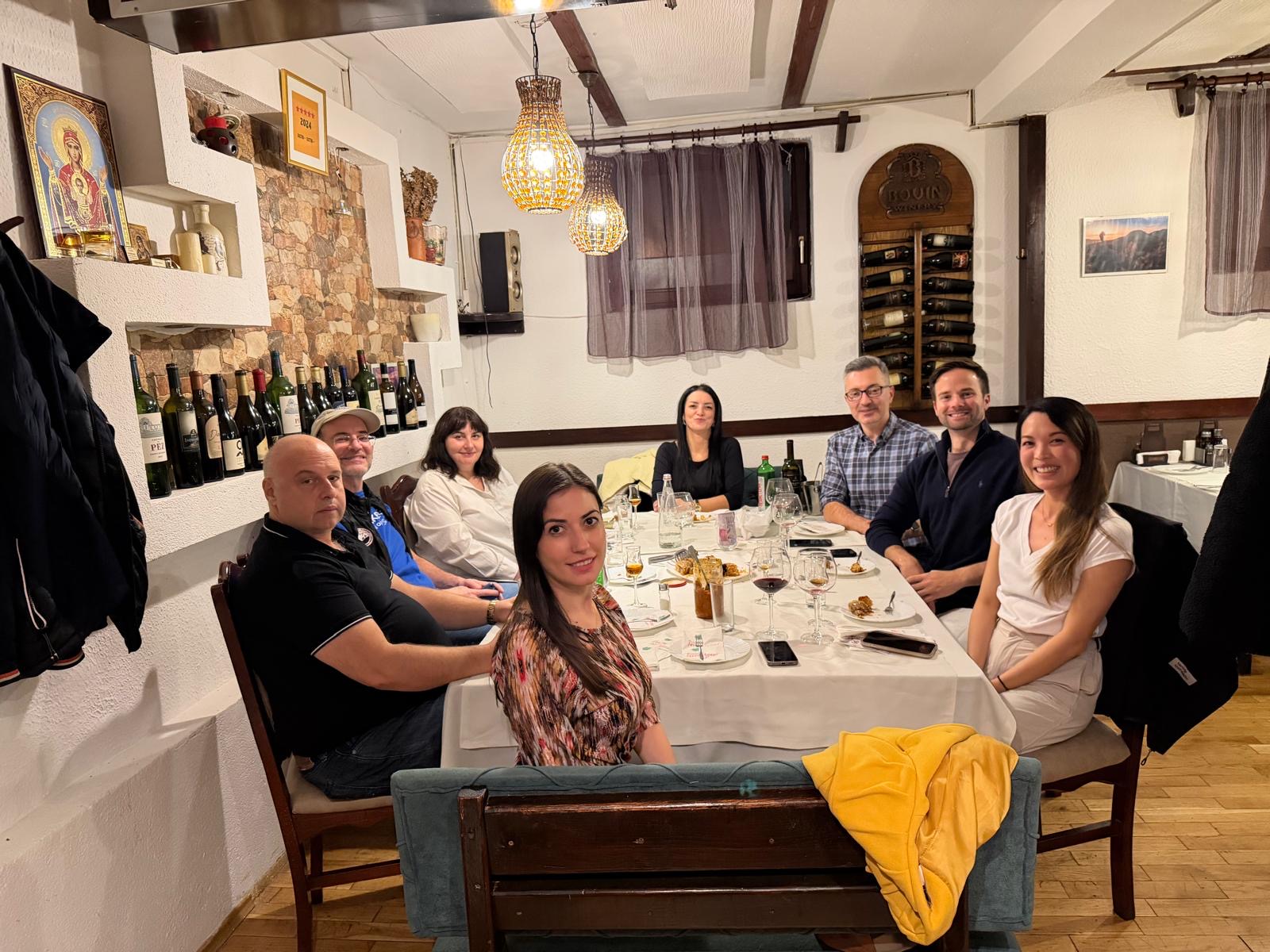 people around a table eating