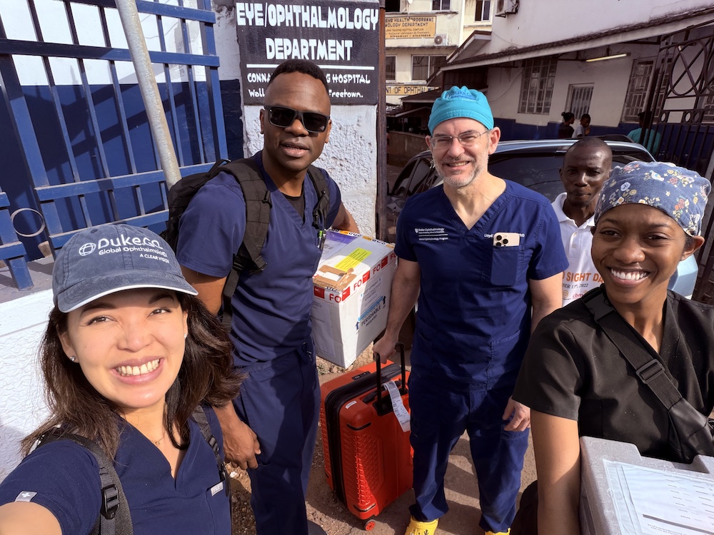 Song and William in front of eye clinic