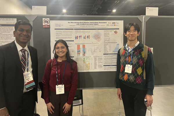 Duke trainees in front of ARVO poster
