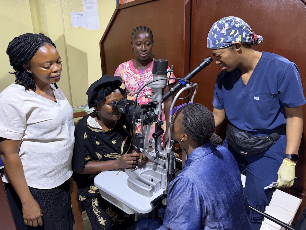 Eye clinic staff performing eye exam