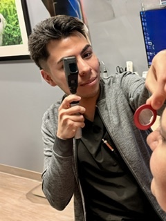 Orthoptist student using scope