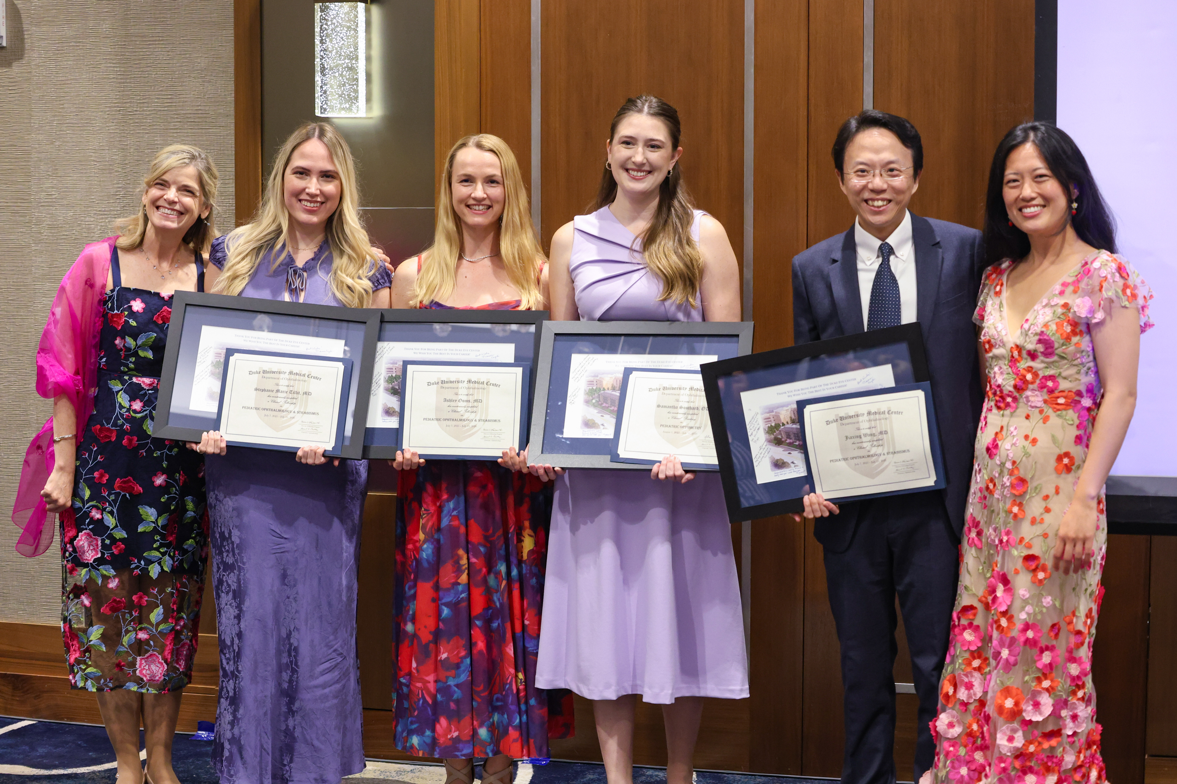 Pediatric fellow group with diplomas