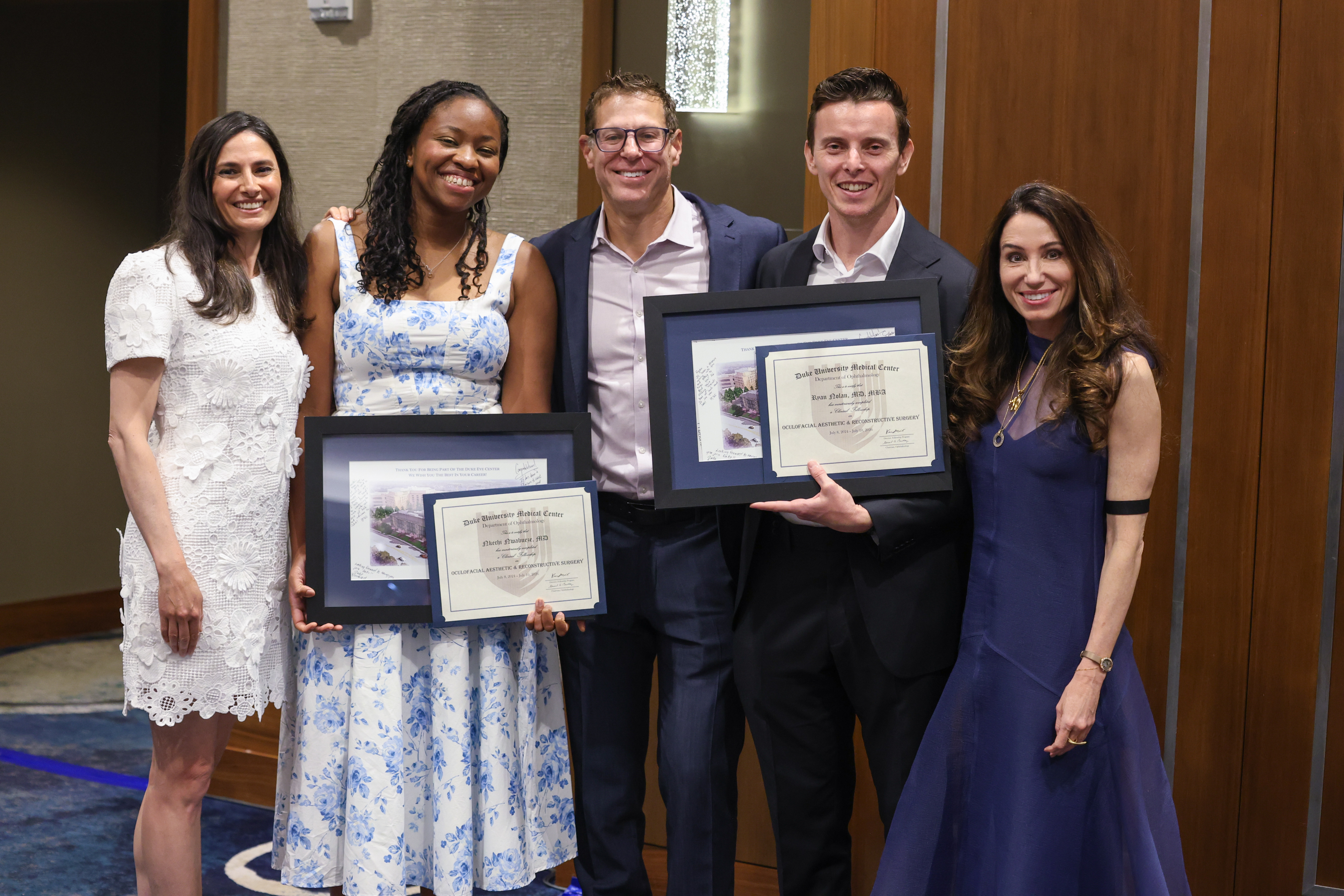 Plastic fellows with diplomas