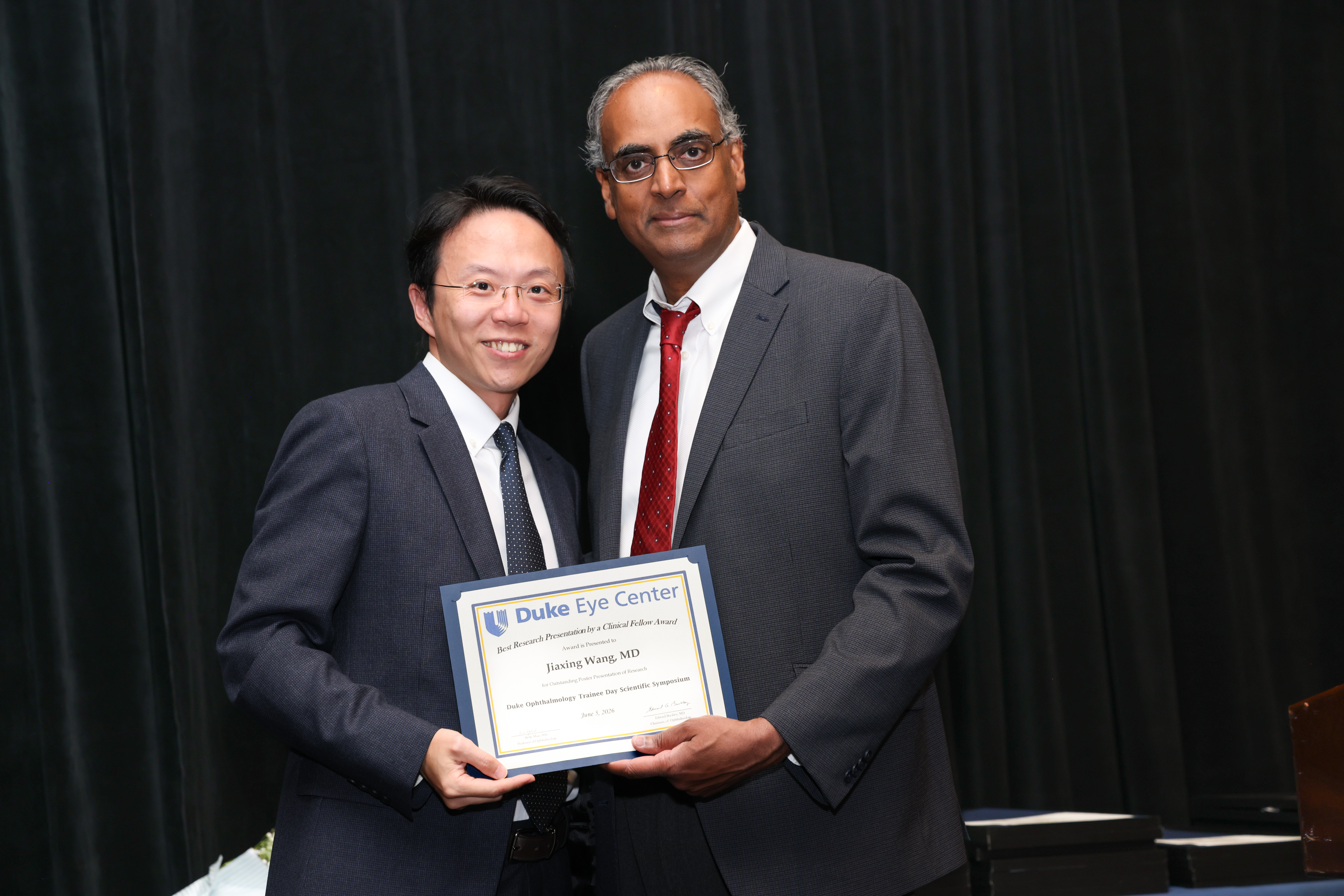 Challa with pediatric fellow presenting plaque for award