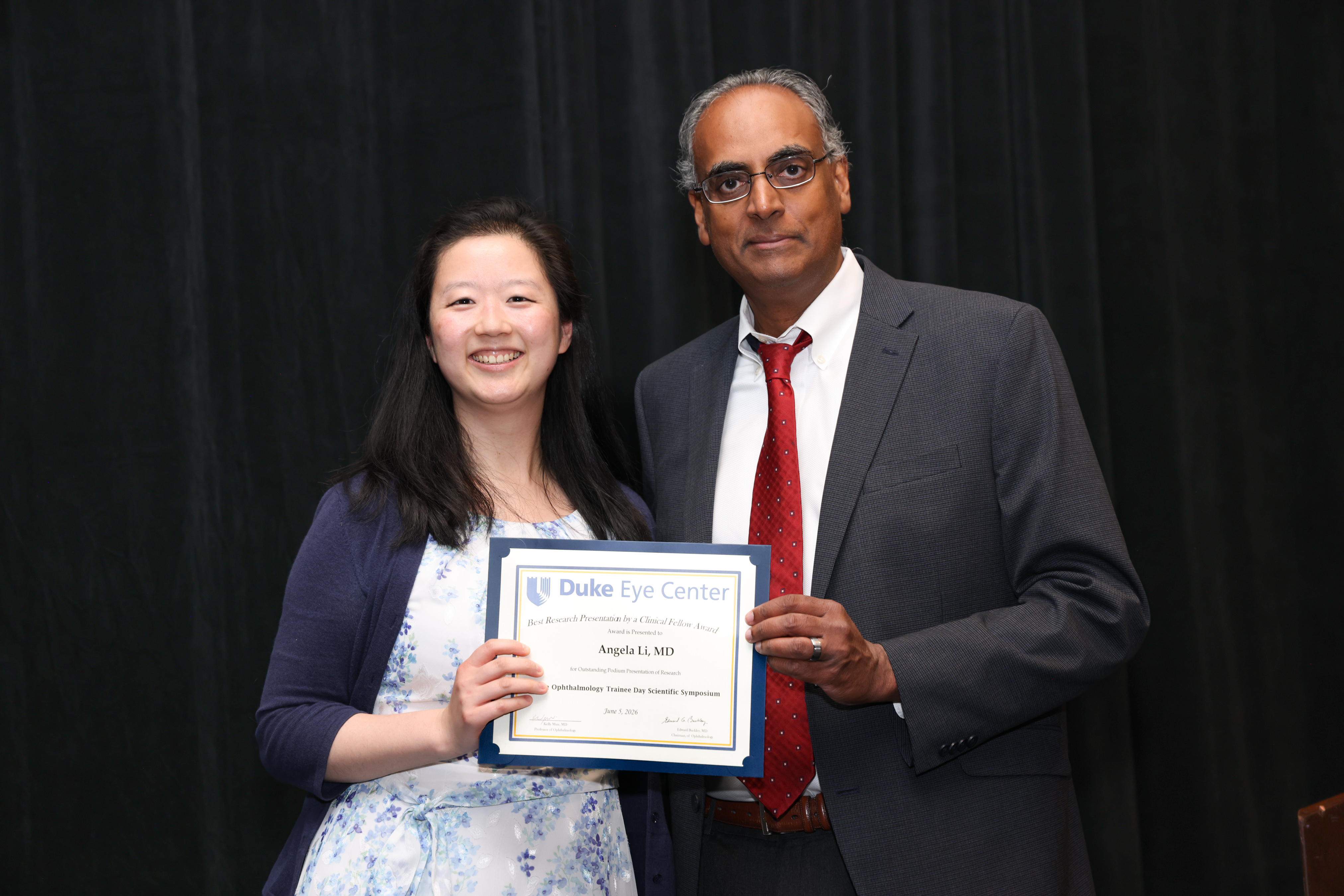 Challa with Angela Li  presenting plaque for award