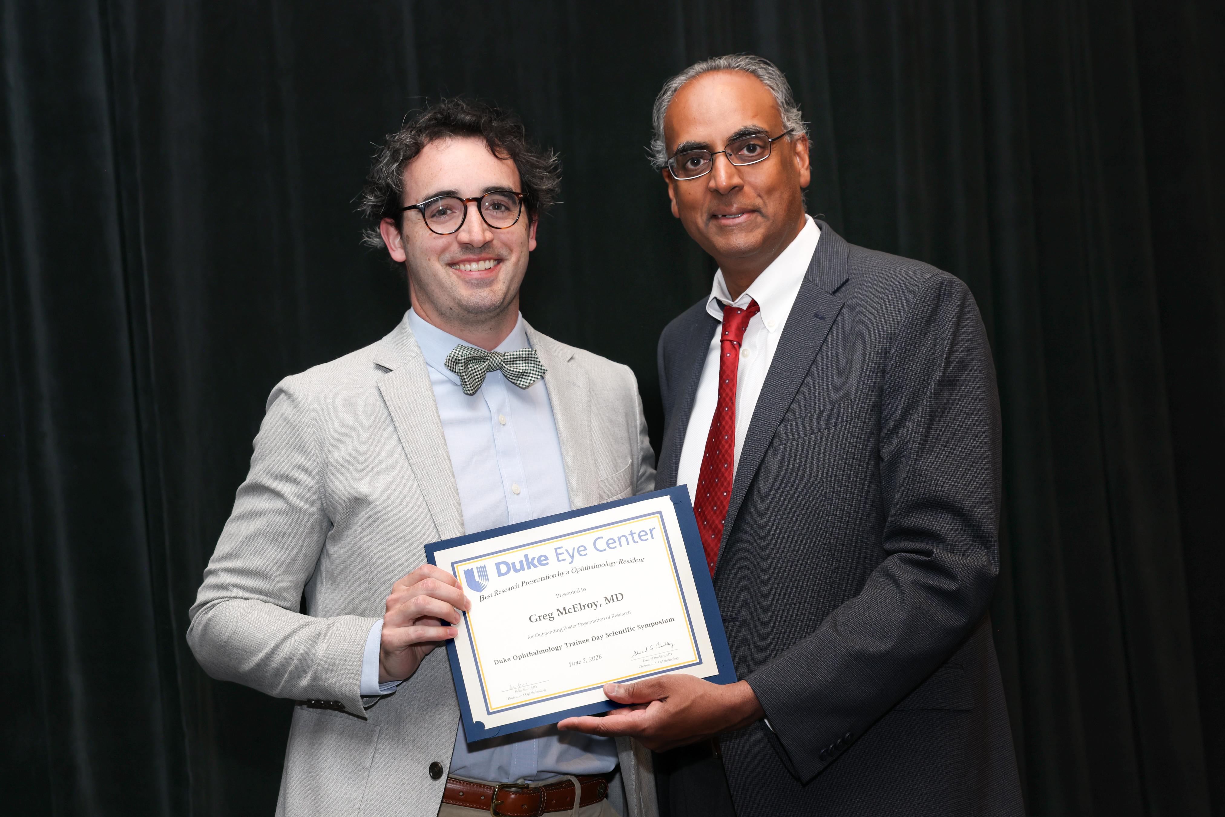 Challa with Greg presenting plaque for award