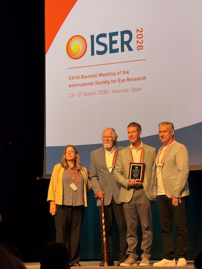 Stamer on stage with award