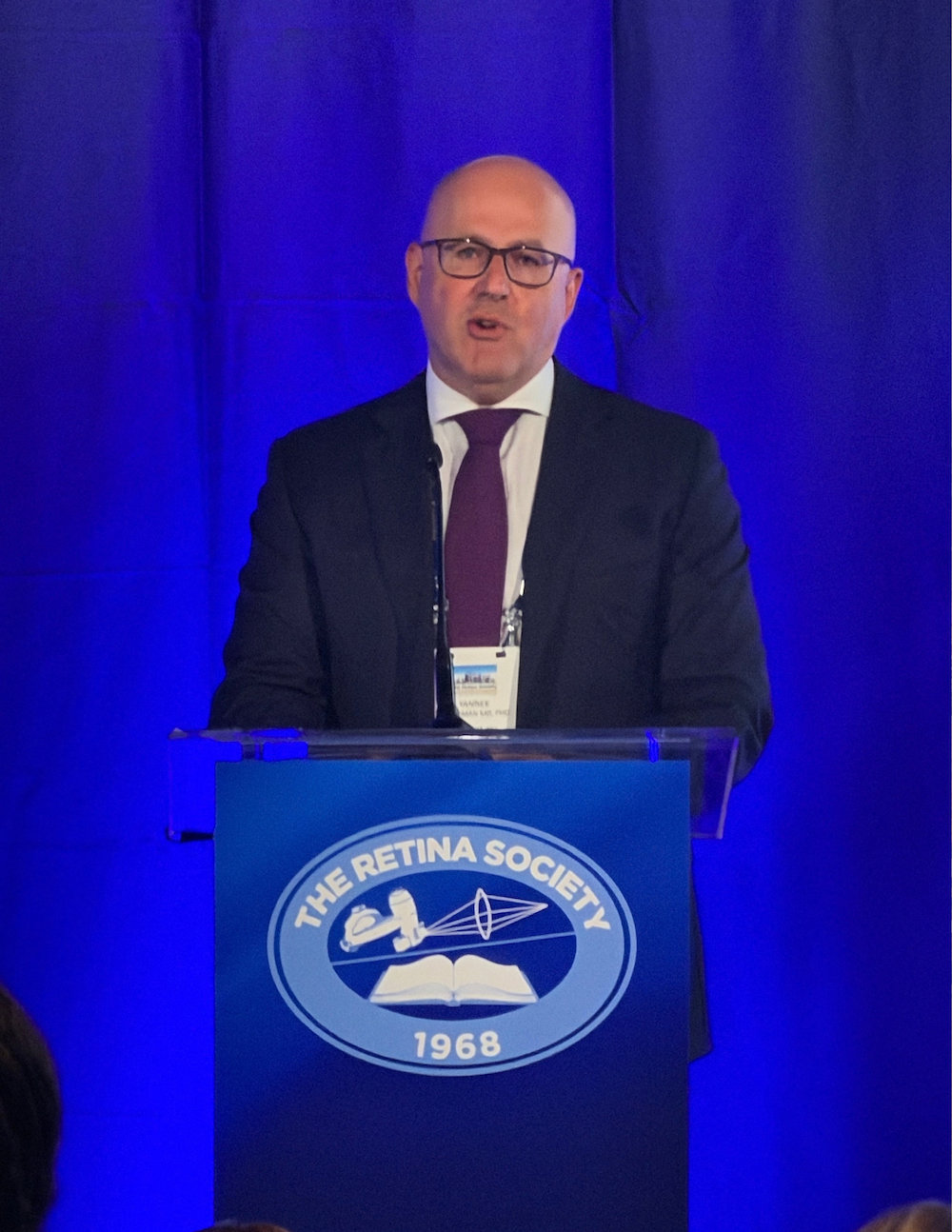 Dr. Leiderman presentign at podium