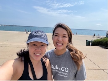 Dr. Grace Prakalapakorn and Dr. Sheena Song representing their Duke swag at the Global Ophthalmology Summit 2025