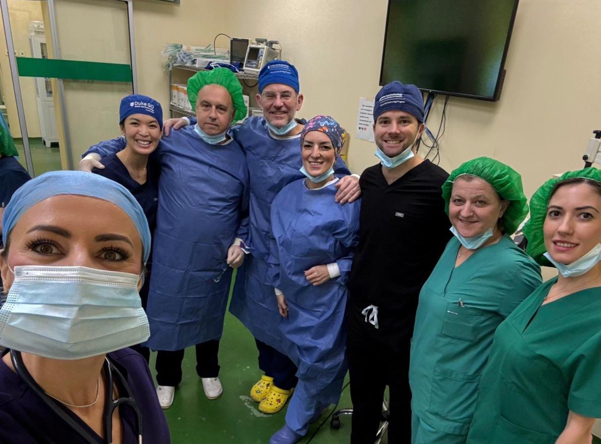 group of ophthalmologists and technicians in operating room