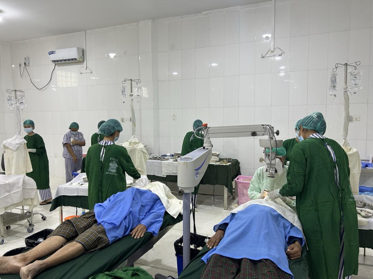 patients laying on table having eye surgery