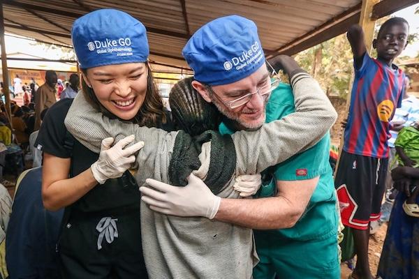 Post operative day one with a patient sharing a joyful hug with Dr. Sheena Song and Dr. Lloyd Williams 