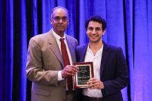 Pratap Challa presenting resident Rami Gabriel with Ocular Innovation award