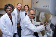 Pratap Challa and resident trainees in the basic science lab